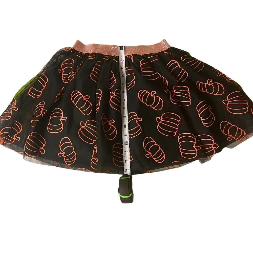 Black tutu orange pumpkins adorn this adorable fall Cat & Jack skirt